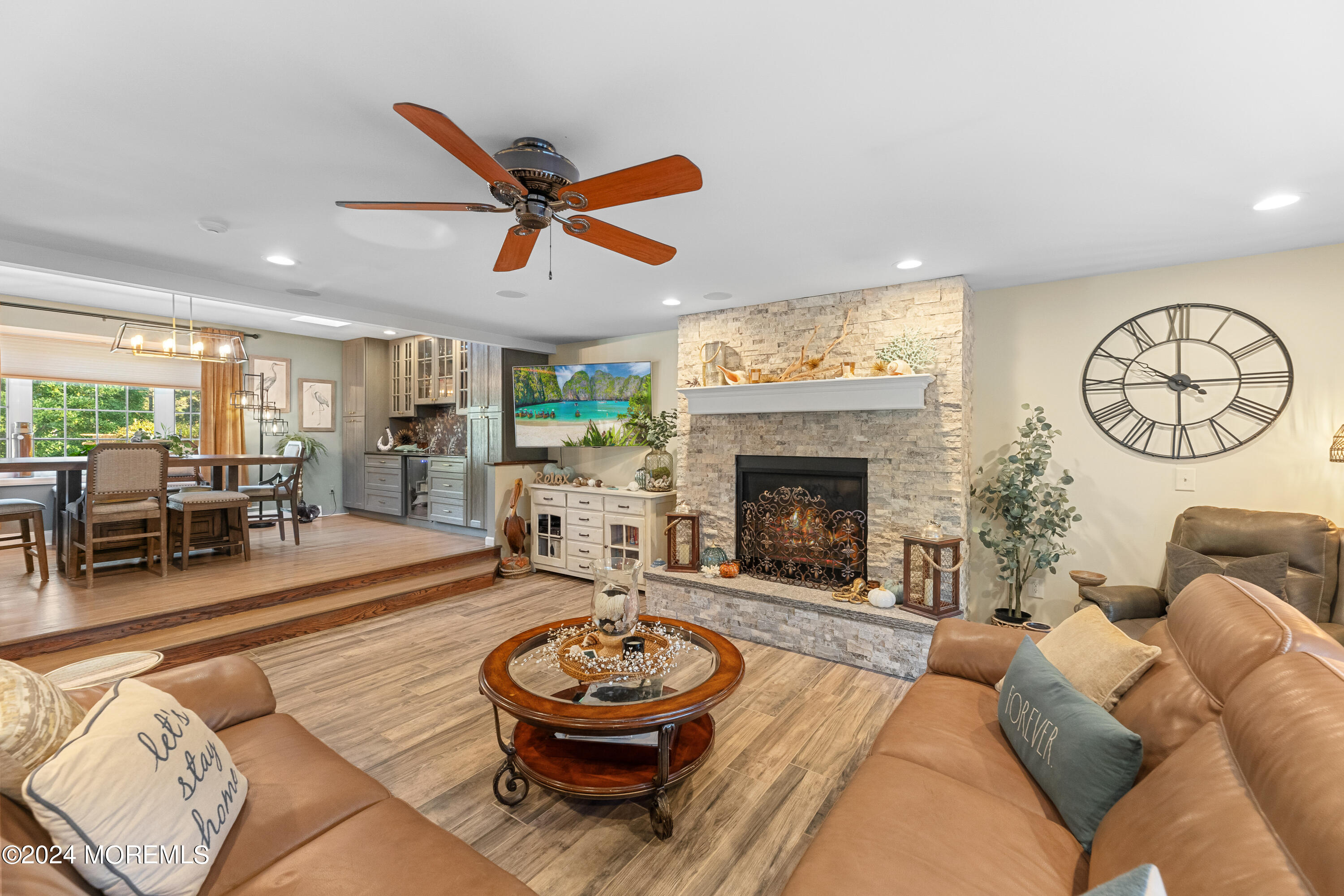 159 Arnold Boulevard Howell, NJ 07731 - Photo 23 of 60 a living room with furniture a rug and a fireplace