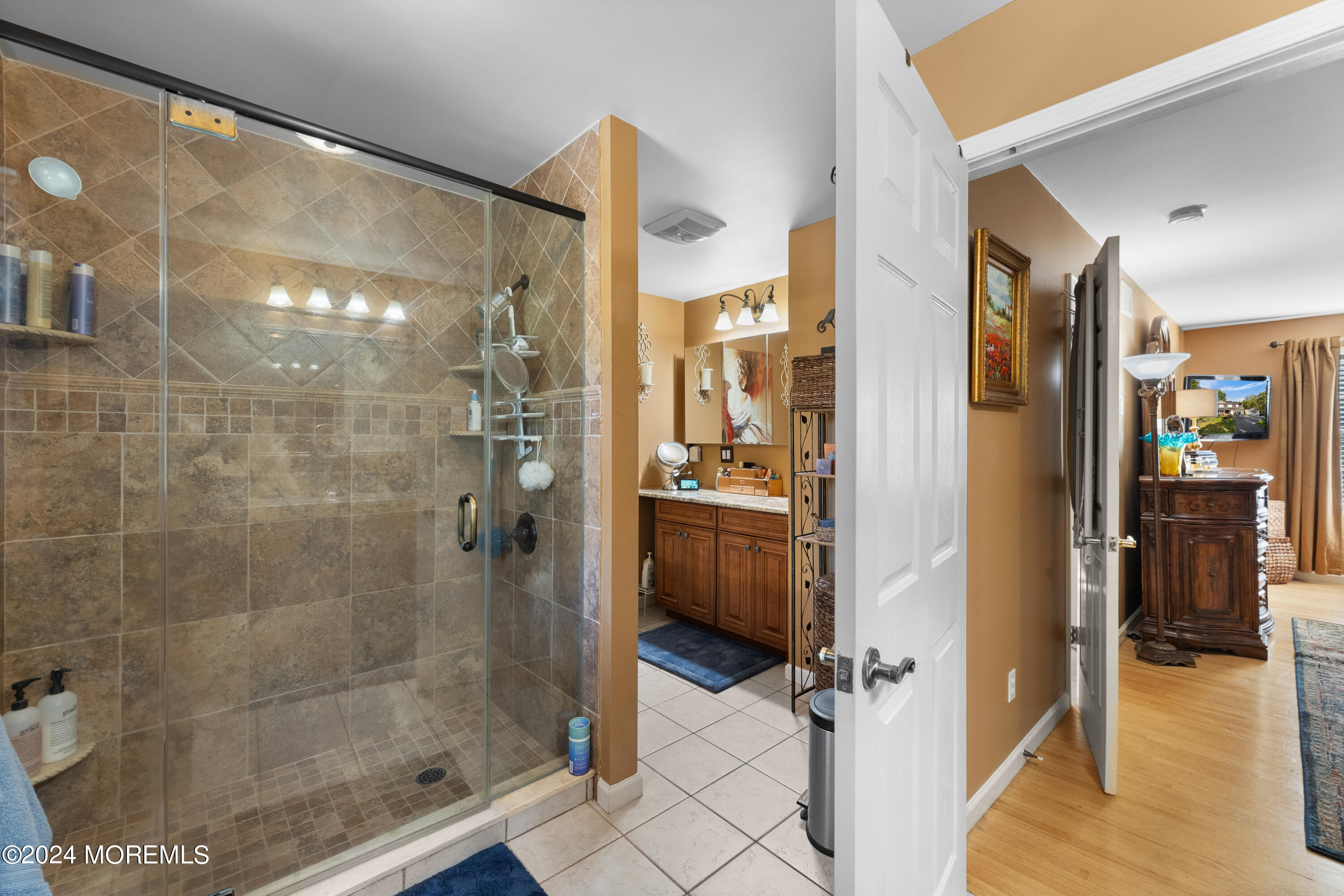 159 Arnold Boulevard Howell, NJ 07731 - Photo 30 of 60 a bathroom with a glass shower door