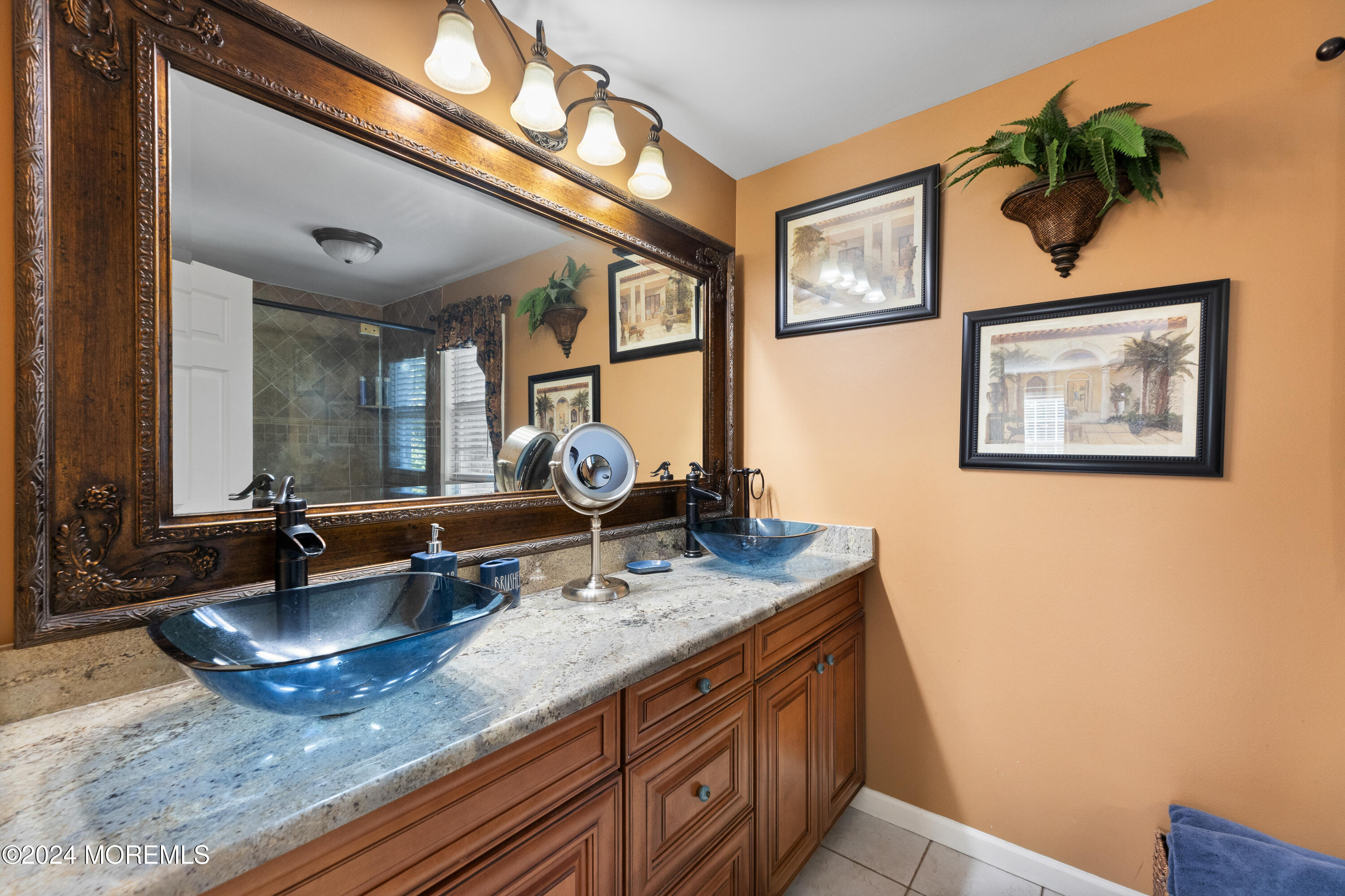159 Arnold Boulevard Howell, NJ 07731 - Photo 31 of 60 a bathroom with a granite countertop sink a mirror and painting on the wall