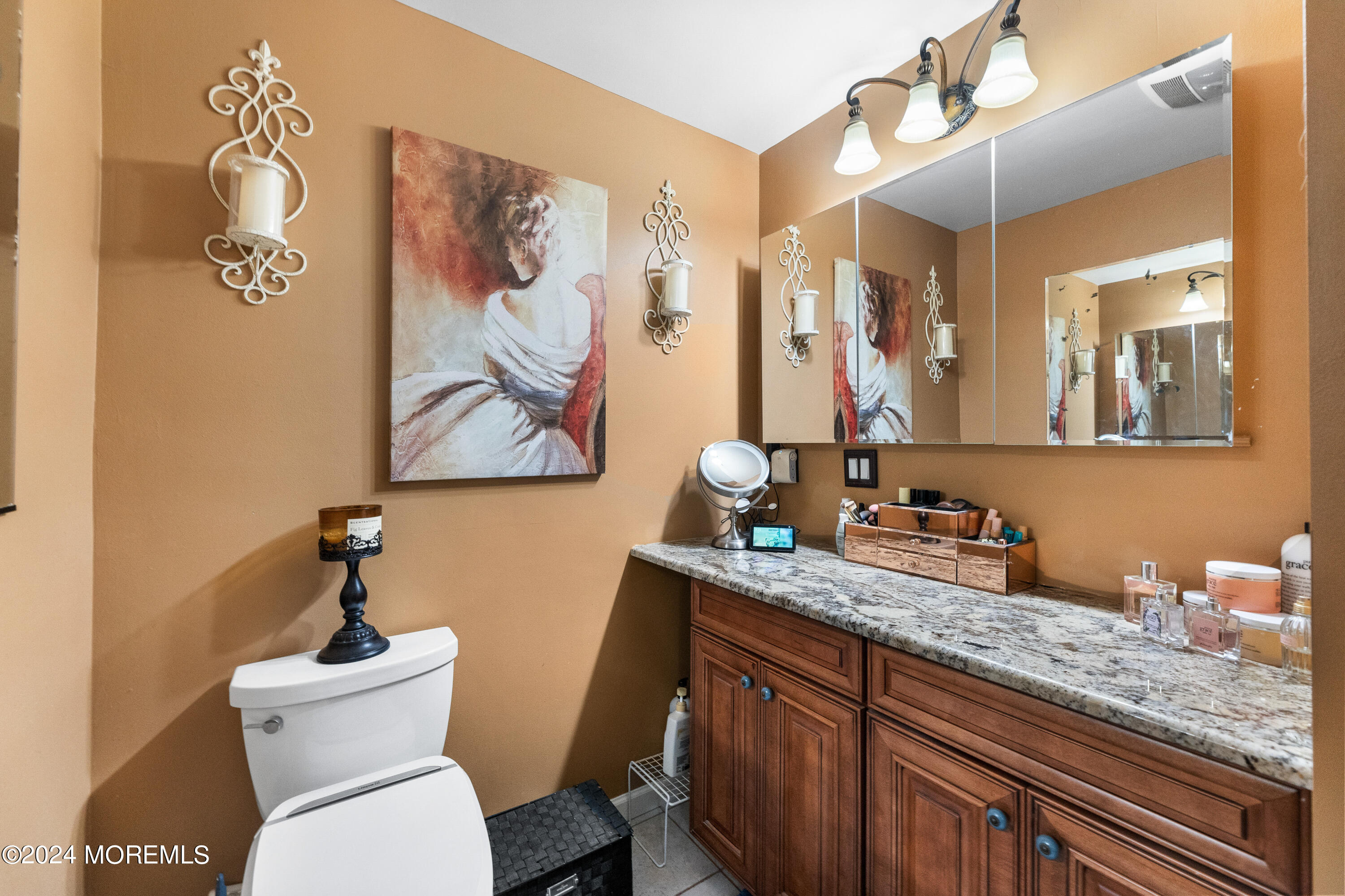 159 Arnold Boulevard Howell, NJ 07731 - Photo 32 of 60 a bathroom with a granite countertop sink mirror vanity and toilet