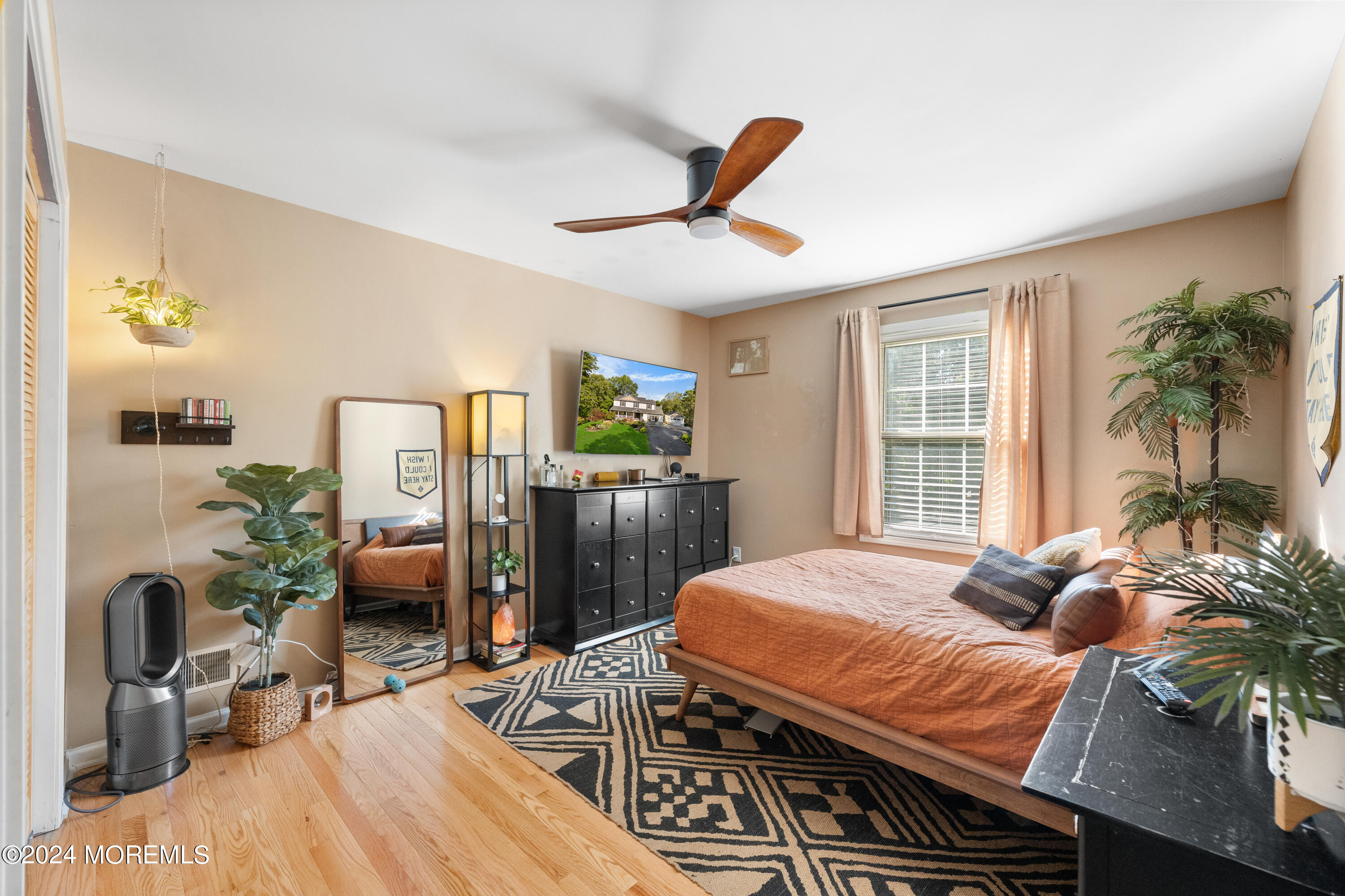 159 Arnold Boulevard Howell, NJ 07731 - Photo 33 of 60 a bedroom with a bed table flowerpot and window