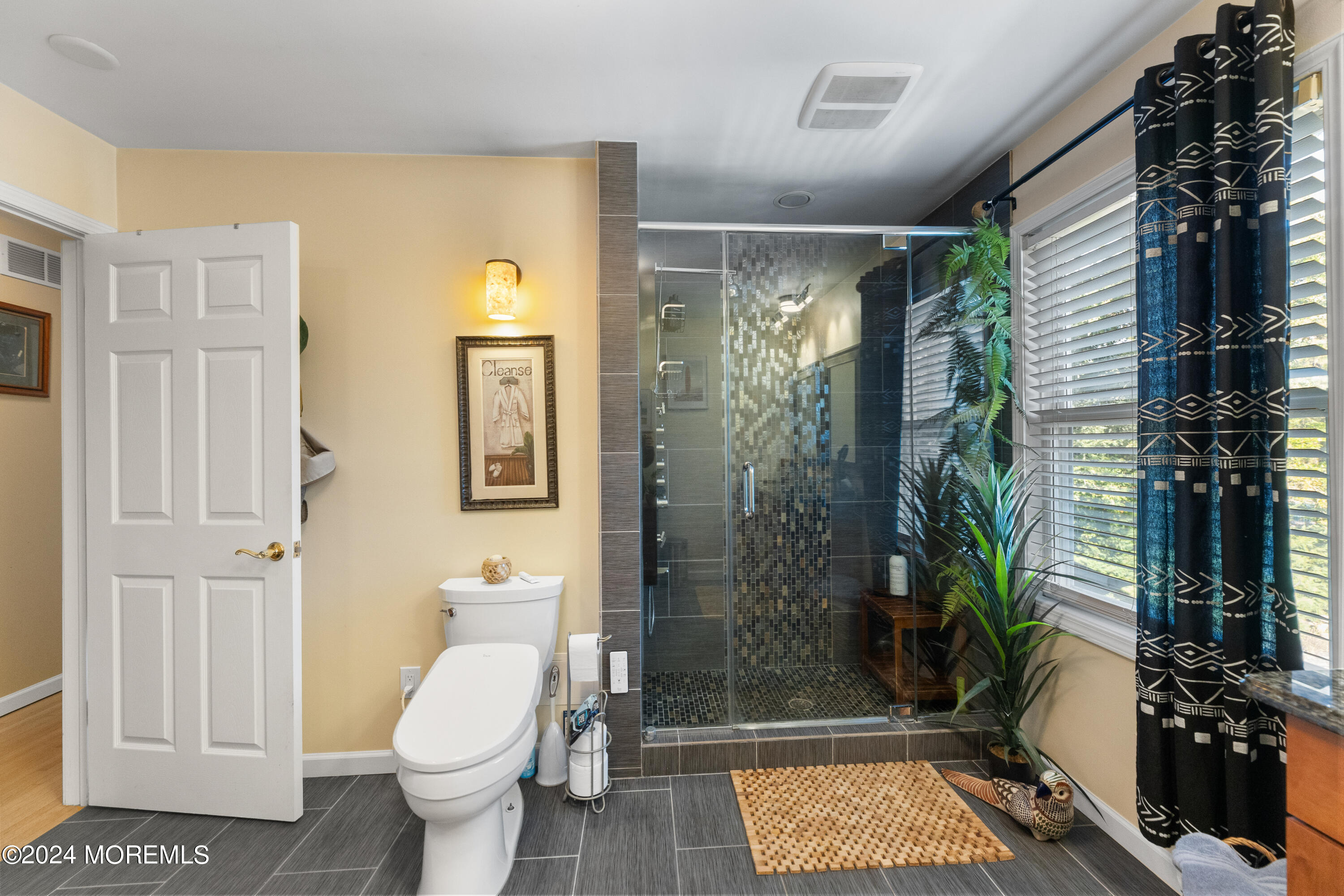 159 Arnold Boulevard Howell, NJ 07731 - Photo 36 of 60 a bathroom with a toilet a sink and shower