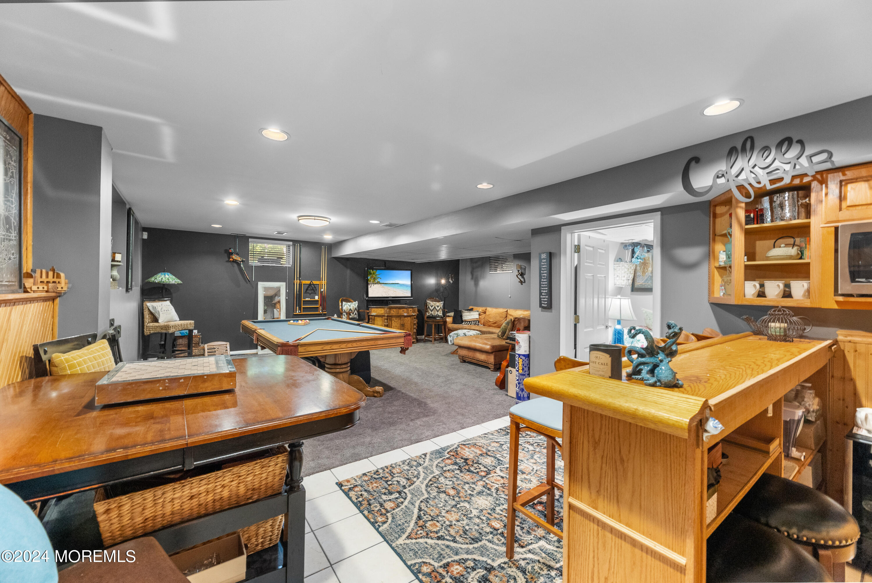 159 Arnold Boulevard Howell, NJ 07731 - Photo 37 of 60 a living room with furniture a rug and a large window