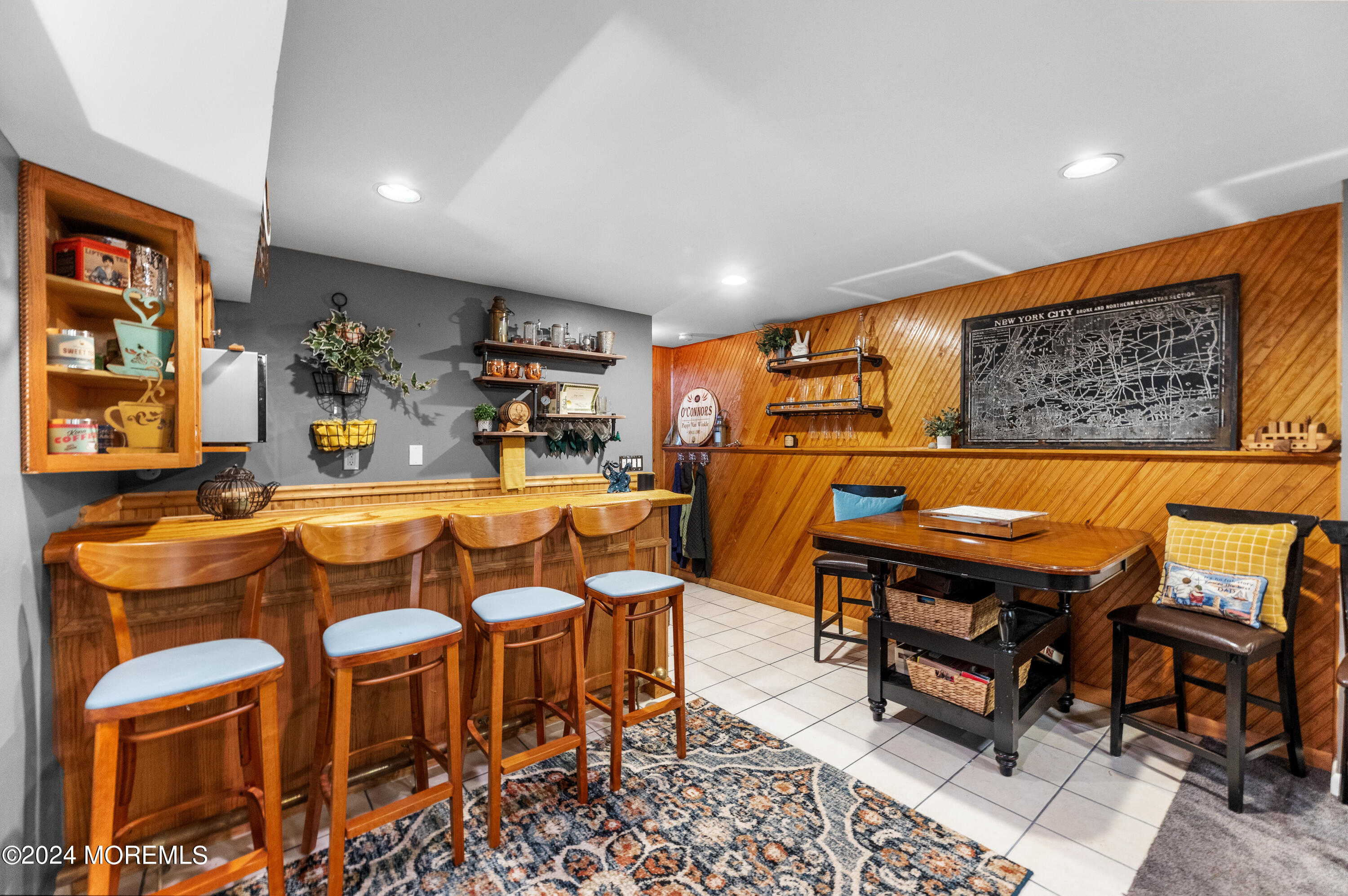 159 Arnold Boulevard Howell, NJ 07731 - Photo 39 of 60 a living room with furniture a rug and a projector
