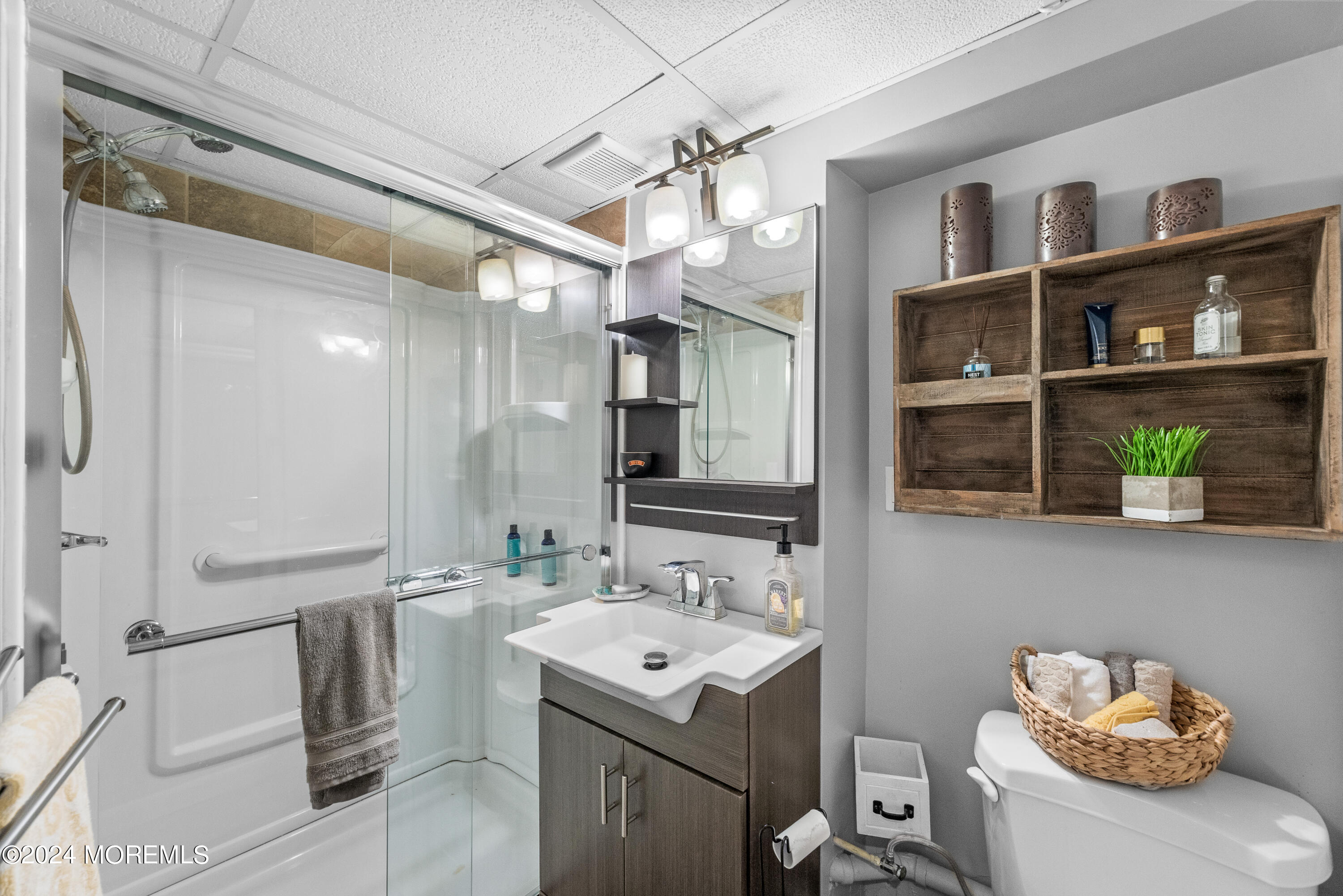 159 Arnold Boulevard Howell, NJ 07731 - Photo 42 of 60 a bathroom with a sink a vanity and a mirror