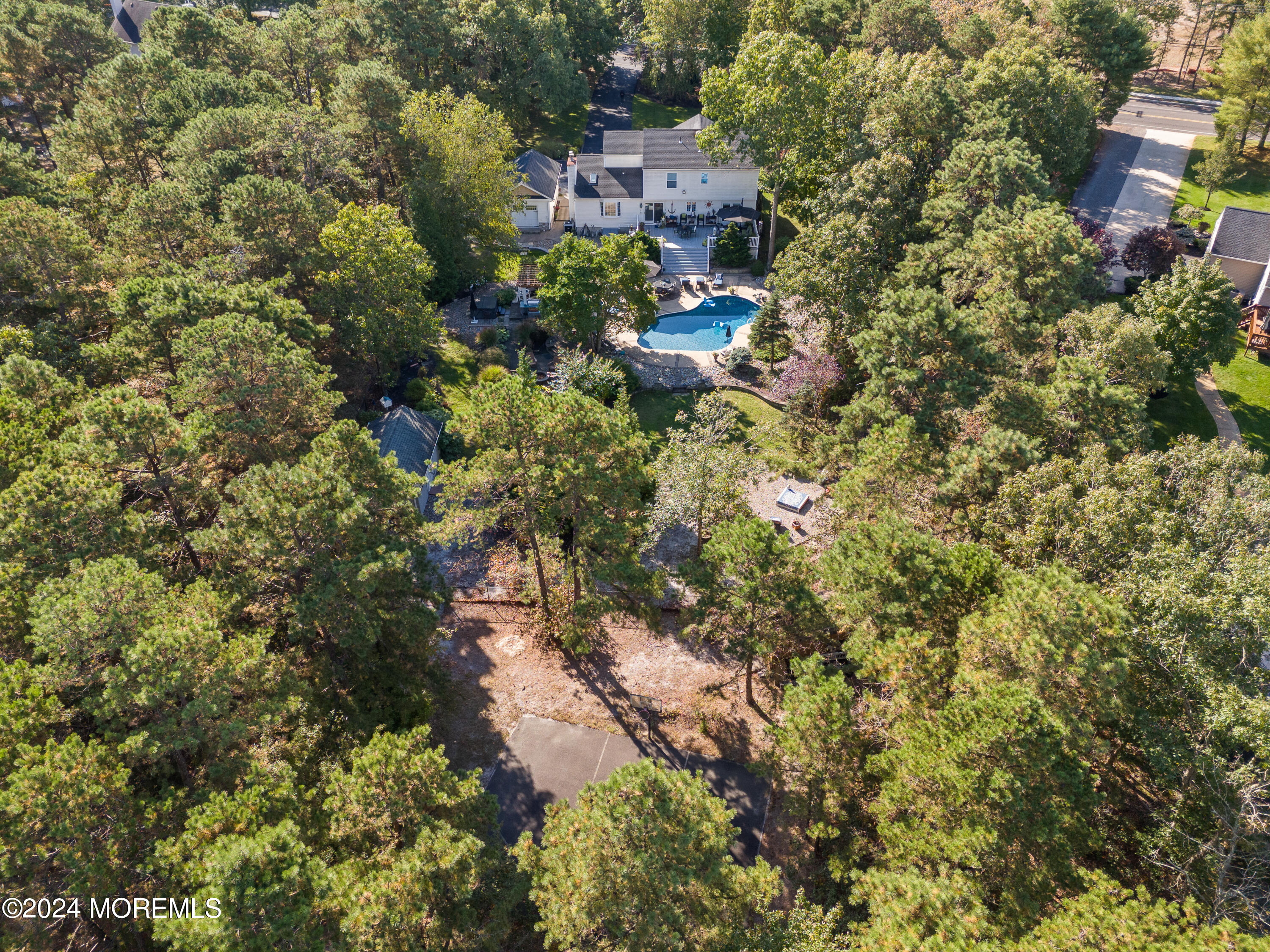 159 Arnold Boulevard Howell, NJ 07731 - Photo 43 of 60 a view of a house with a yard and covered with trees