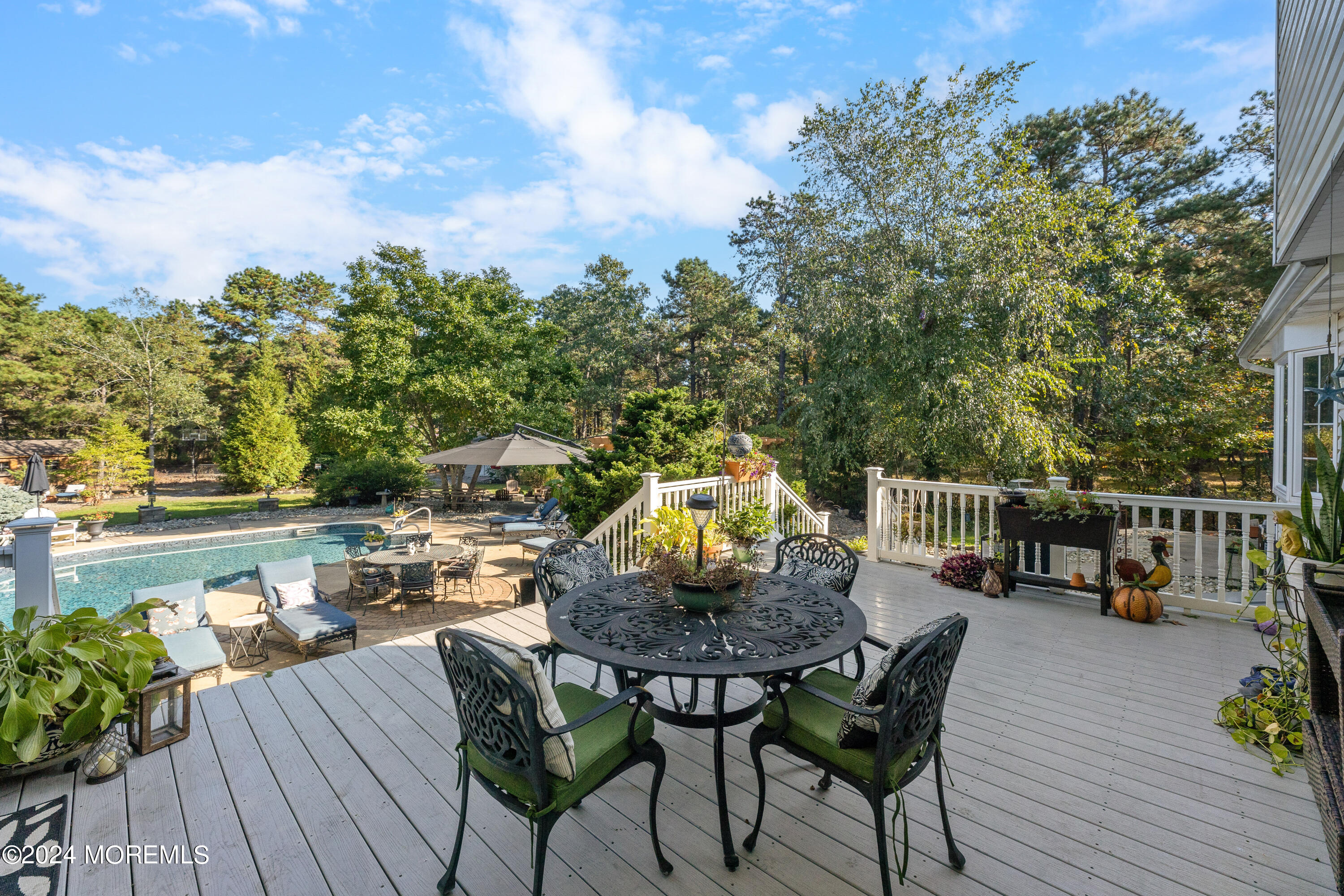 159 Arnold Boulevard Howell, NJ 07731 - Photo 55 of 60 a view of a balcony with furniture and a garden