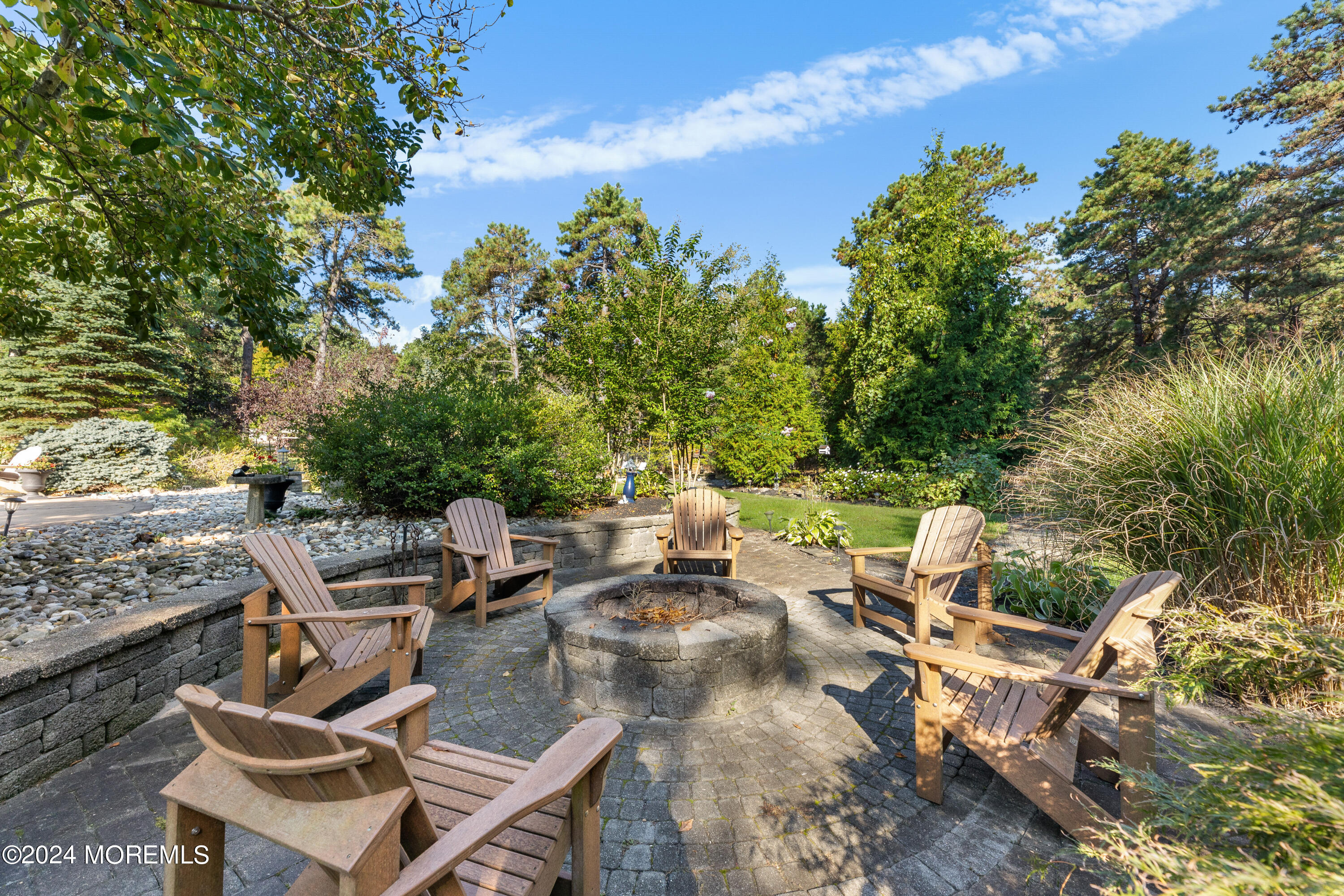 159 Arnold Boulevard Howell, NJ 07731 - Photo 57 of 60 a view of a patio with table and chairs and potted plants