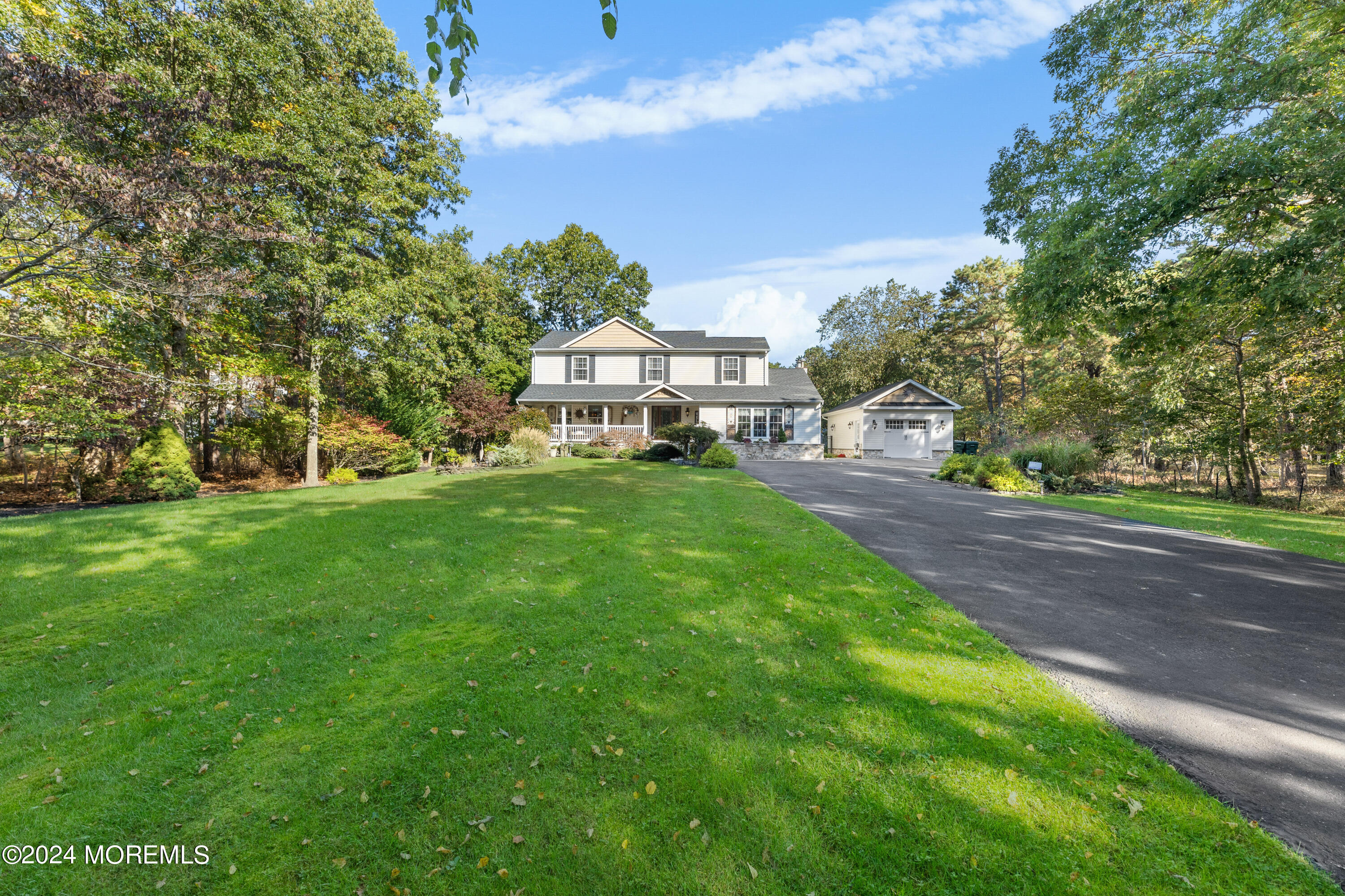 159 Arnold Boulevard Howell, NJ 07731 - Photo 6 of 60 a view of a park with large trees