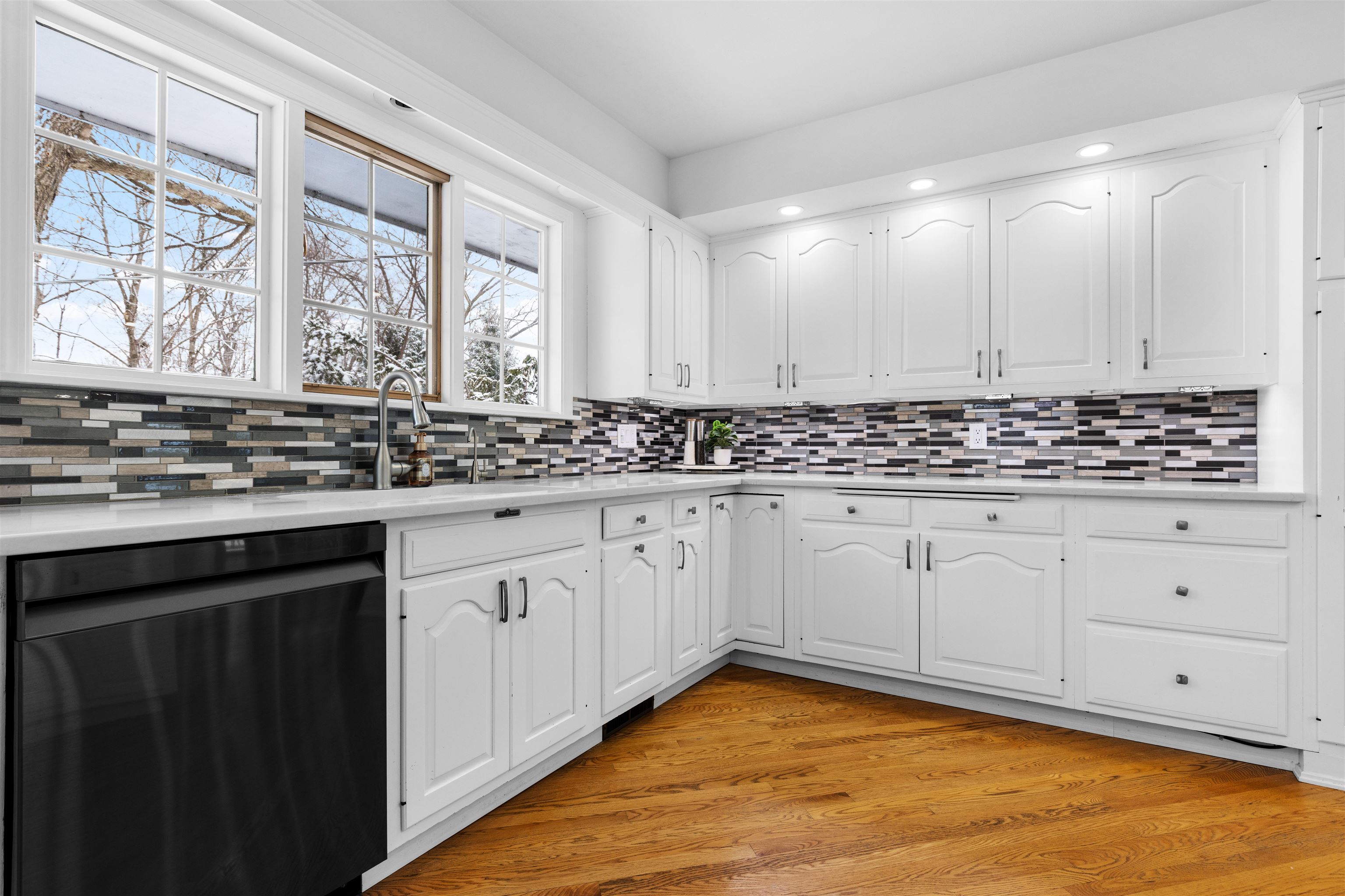 5150 Guilford Road Rockford, IL 61107 - Photo 7 of 33 a view of a kitchen with stainless steel appliances granite countertop a stove a sink dishwasher and cabinets with wooden floor