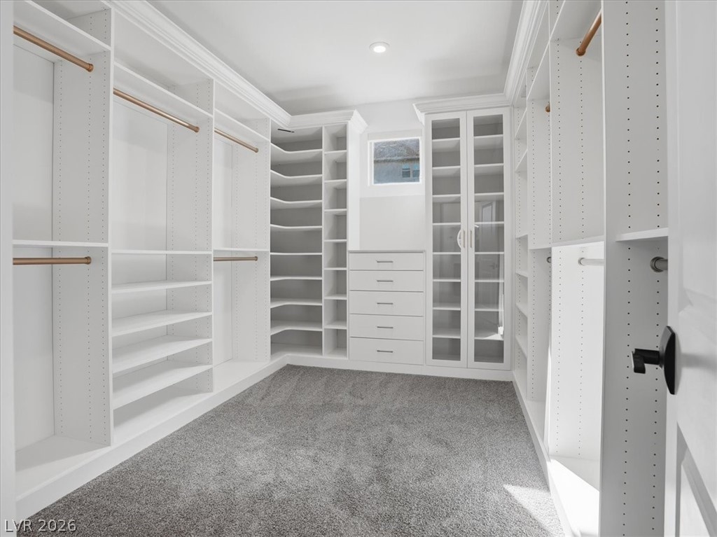 9725 Starlight Ridge Avenue Las Vegas, NV 89148 - Photo 5 of 47 This spacious closet offers custom built-ins, ample storage, and abundant natural light.