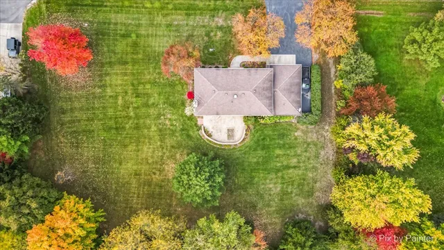 an aerial view of residential house with an outdoor space
