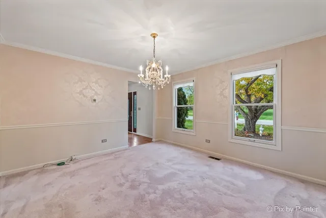 an empty room with windows and entrance