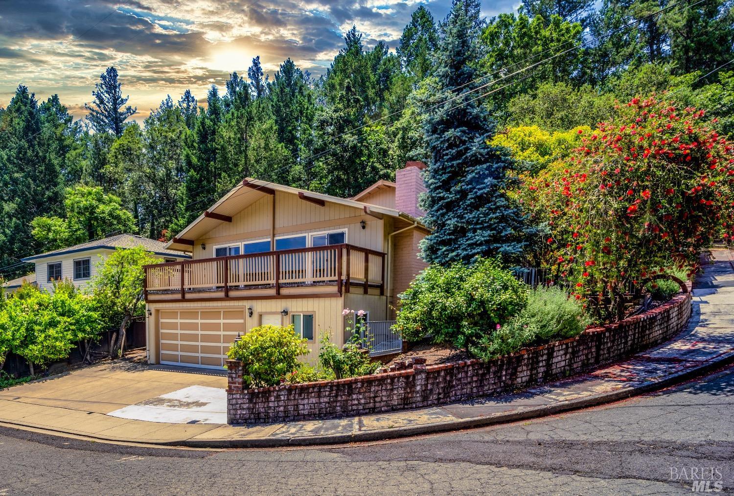 a house with lots of trees in the background