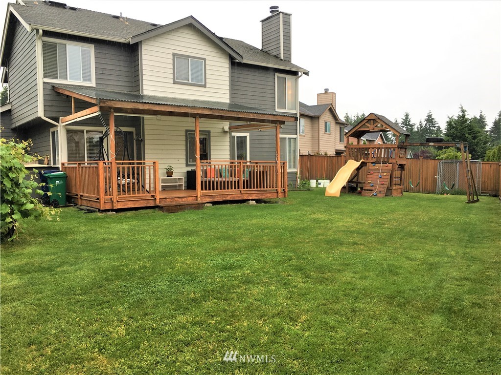 35127 11th Place Southwest Federal Way, WA 98023 - Photo 3 of 31 a view of a house with a yard and deck