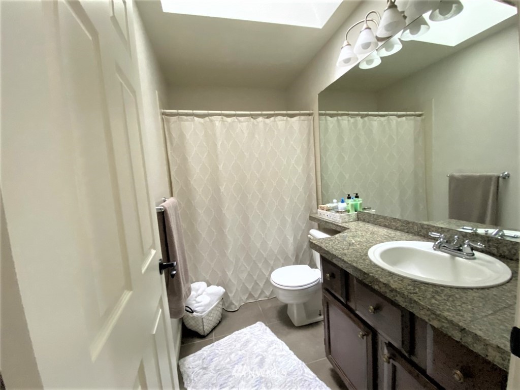 35127 11th Place Southwest Federal Way, WA 98023 - Photo 25 of 31 a bathroom with a granite countertop sink toilet and shower