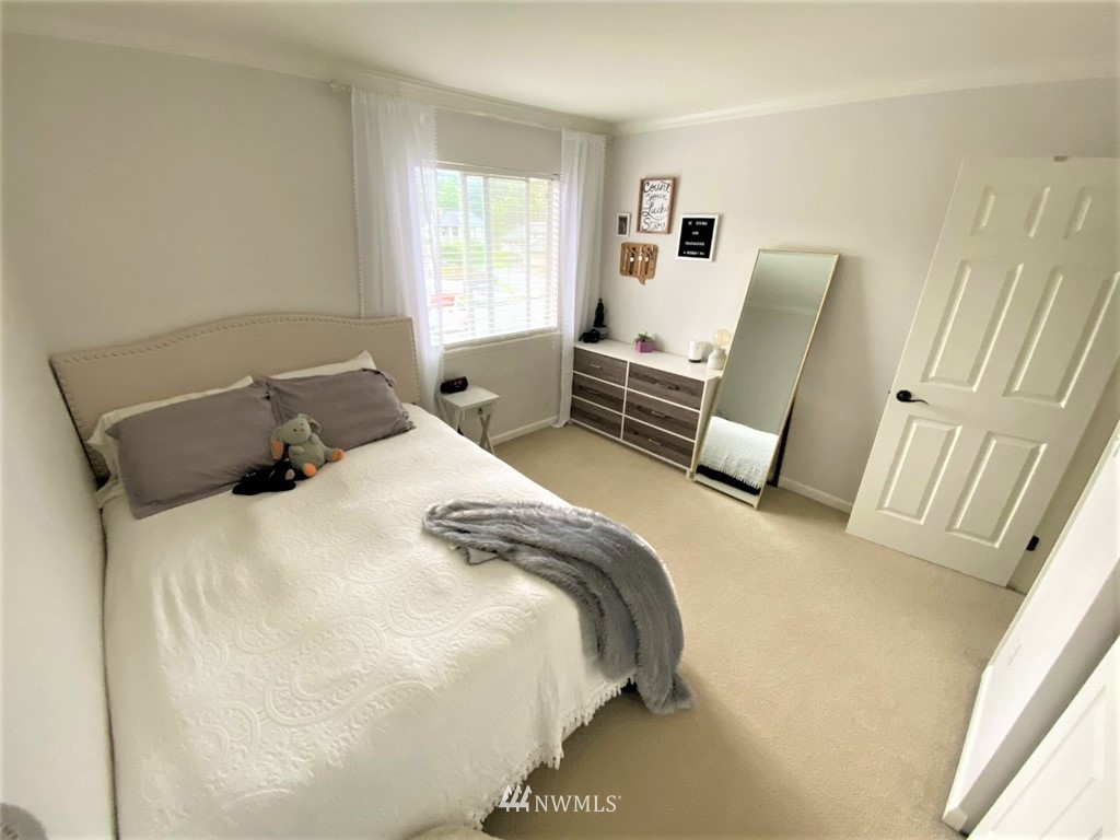 35127 11th Place Southwest Federal Way, WA 98023 - Photo 10 of 31 a bedroom with a bed and wooden floor