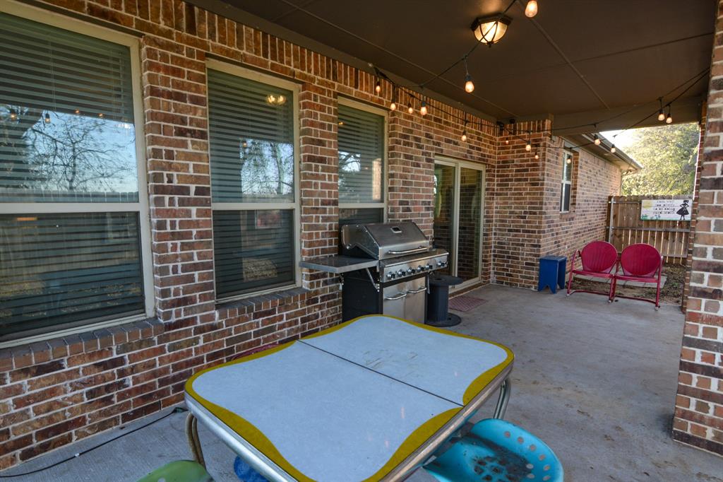 601 Mathew Street Grandview, TX 76050 - Photo 39 of 40 a gym with pool table and outdoor seating