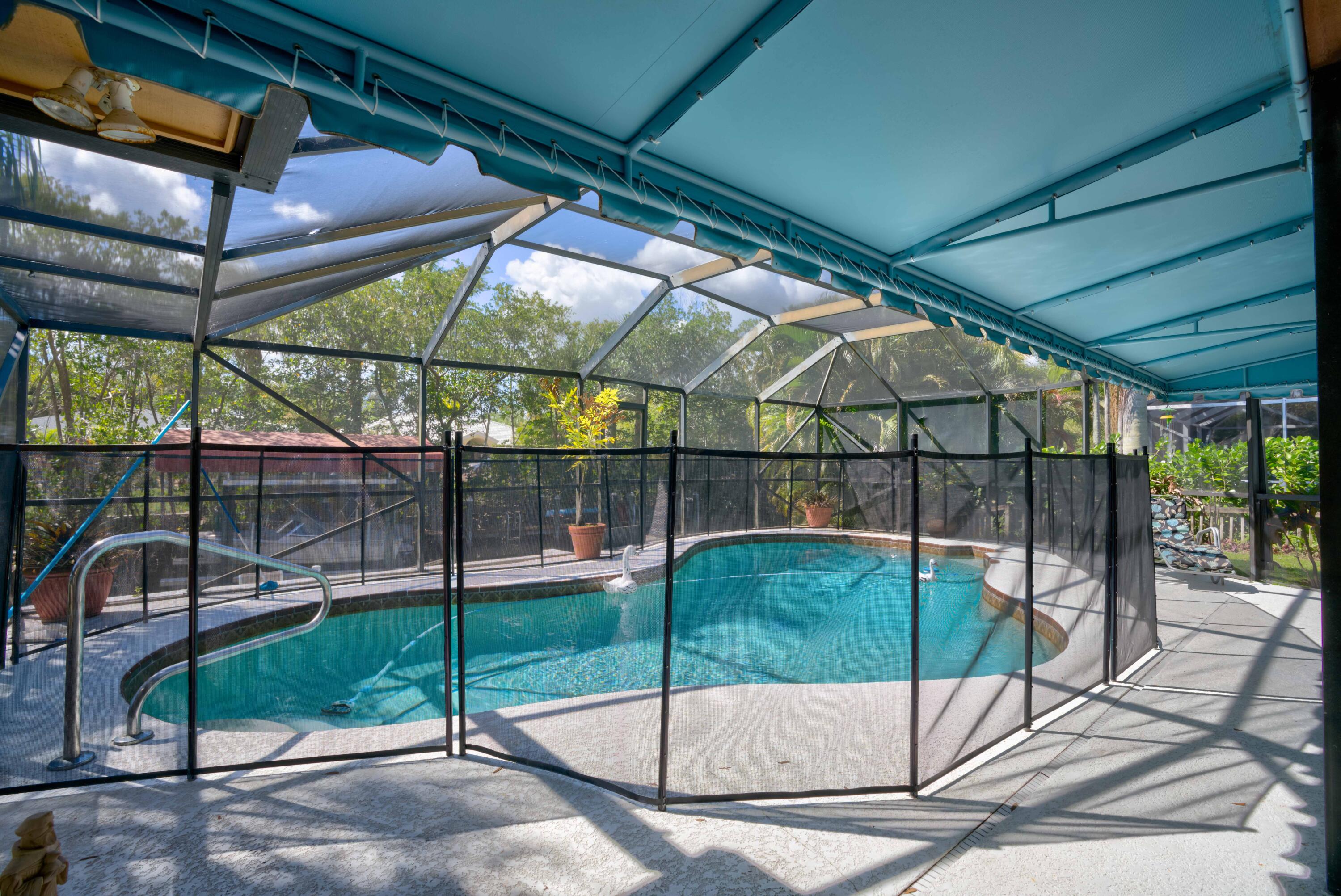 9524 Southeast Cove Point Street Jupiter, FL 33469 - Photo 7 of 58 Screened pool