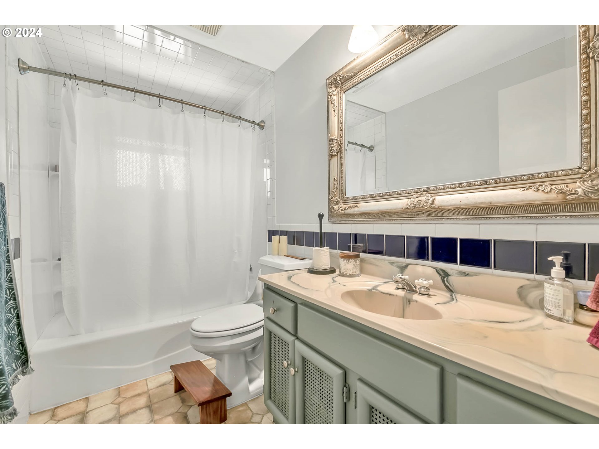 5000 Whiteaker Street Eugene, OR 97405 - Photo 13 of 18 a bathroom with a sink a toilet and a mirror