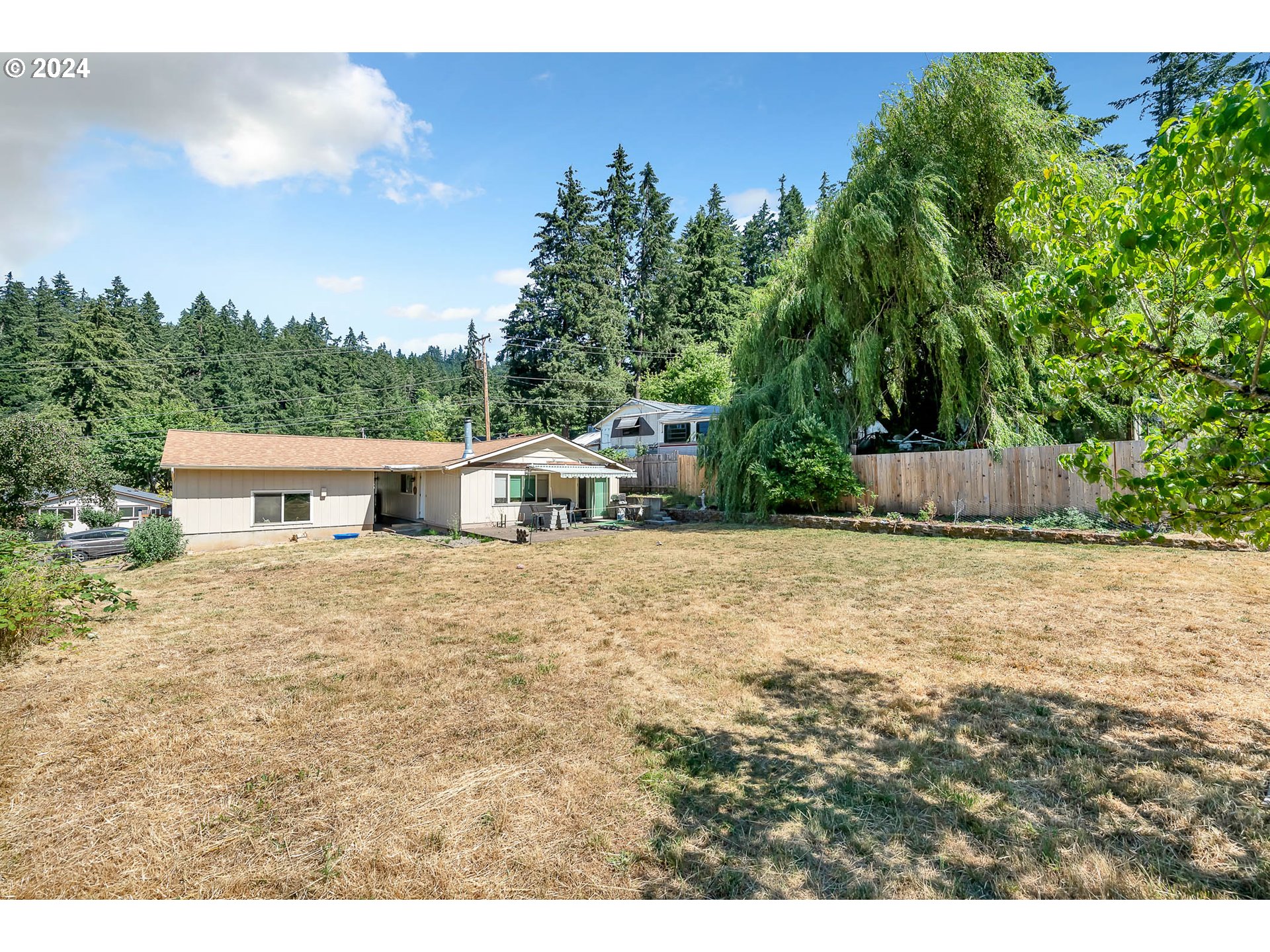 5000 Whiteaker Street Eugene, OR 97405 - Photo 16 of 18 a front view of a house with a yard