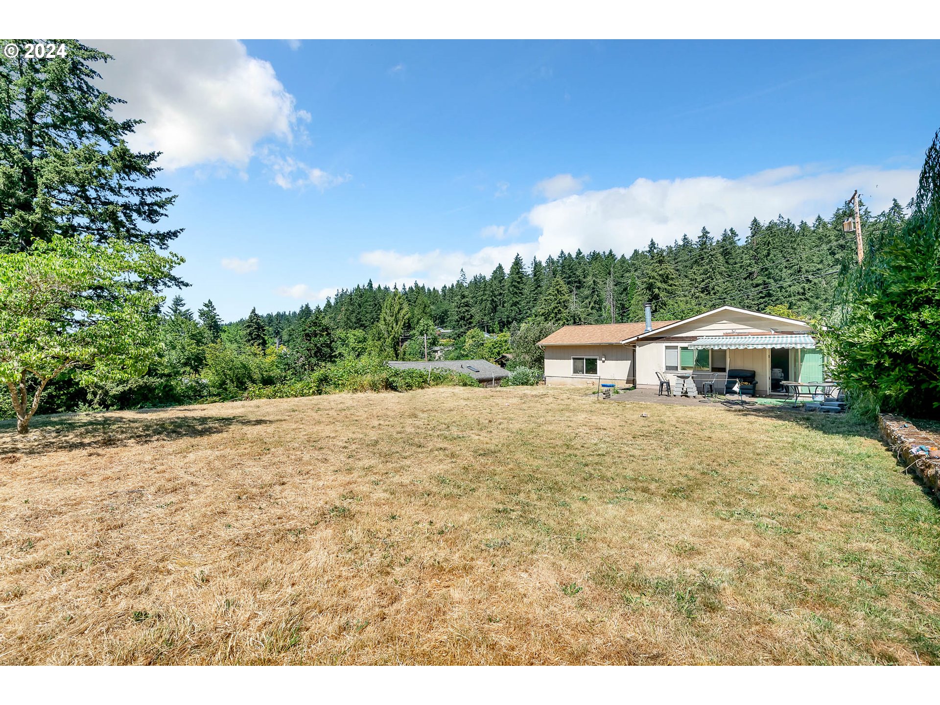 5000 Whiteaker Street Eugene, OR 97405 - Photo 17 of 18 a view of a house with a yard