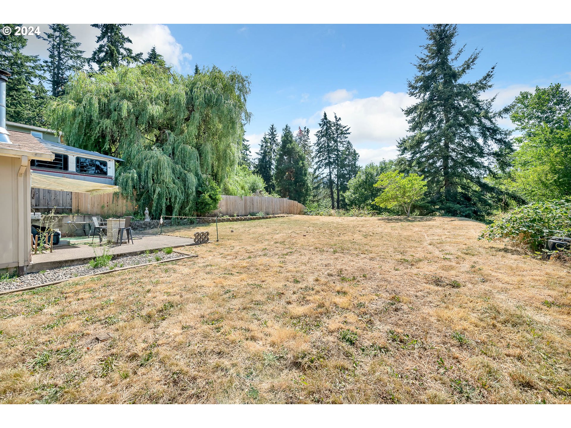 5000 Whiteaker Street Eugene, OR 97405 - Photo 18 of 18 a backyard of a house with table and chairs