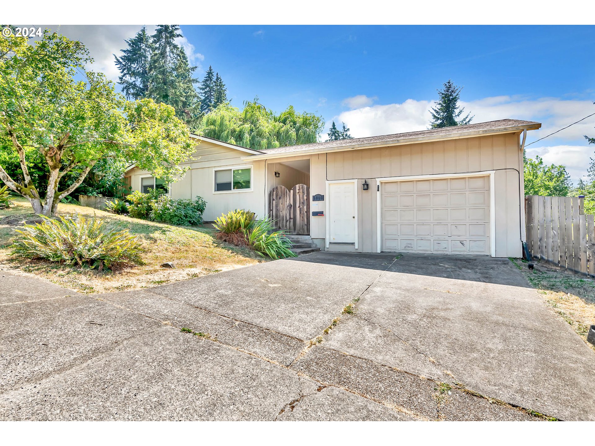 5000 Whiteaker Street Eugene, OR 97405 - Photo 2 of 18 front view of a house with a yard