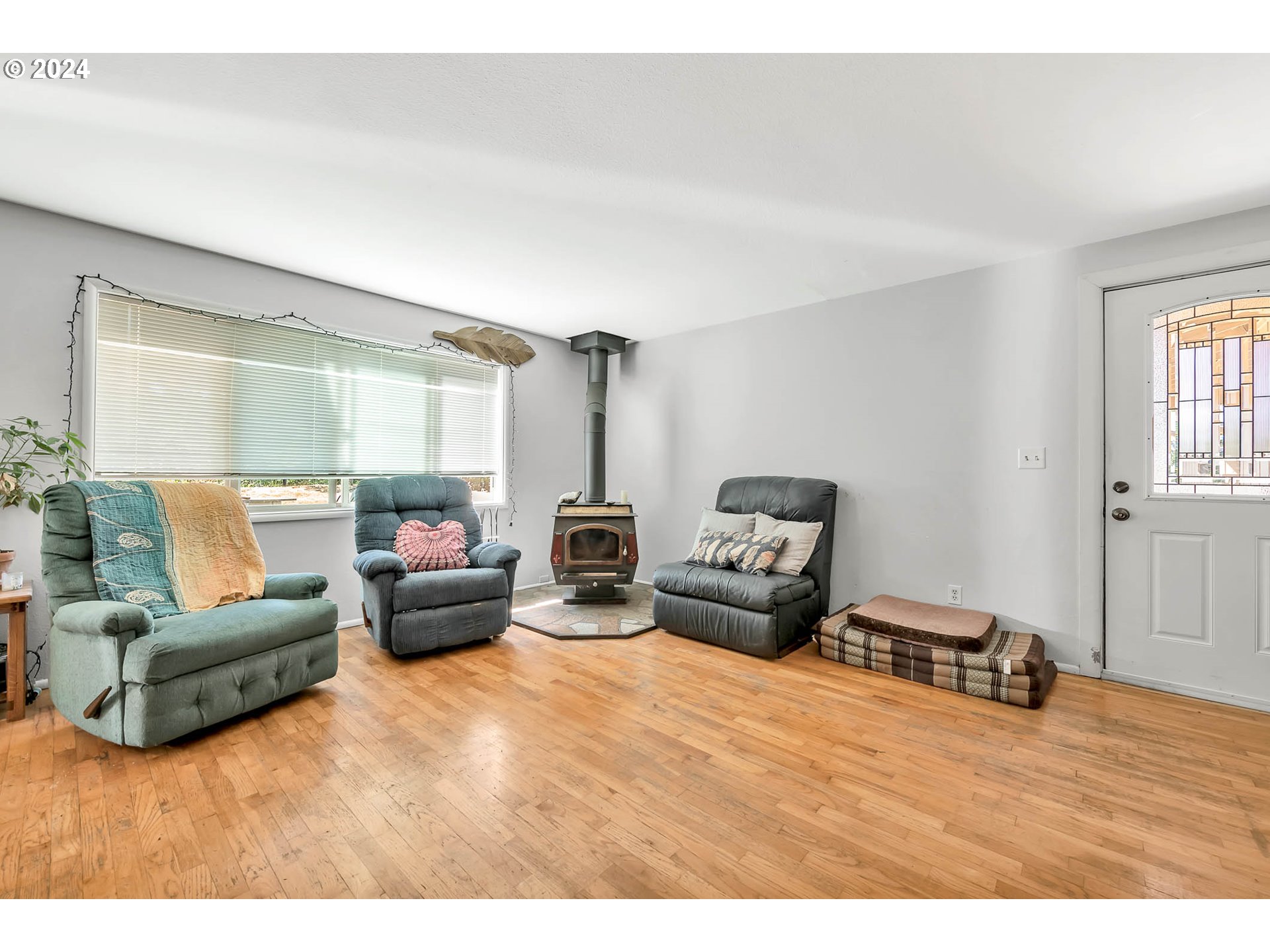5000 Whiteaker Street Eugene, OR 97405 - Photo 5 of 18 a living room with furniture and a large window