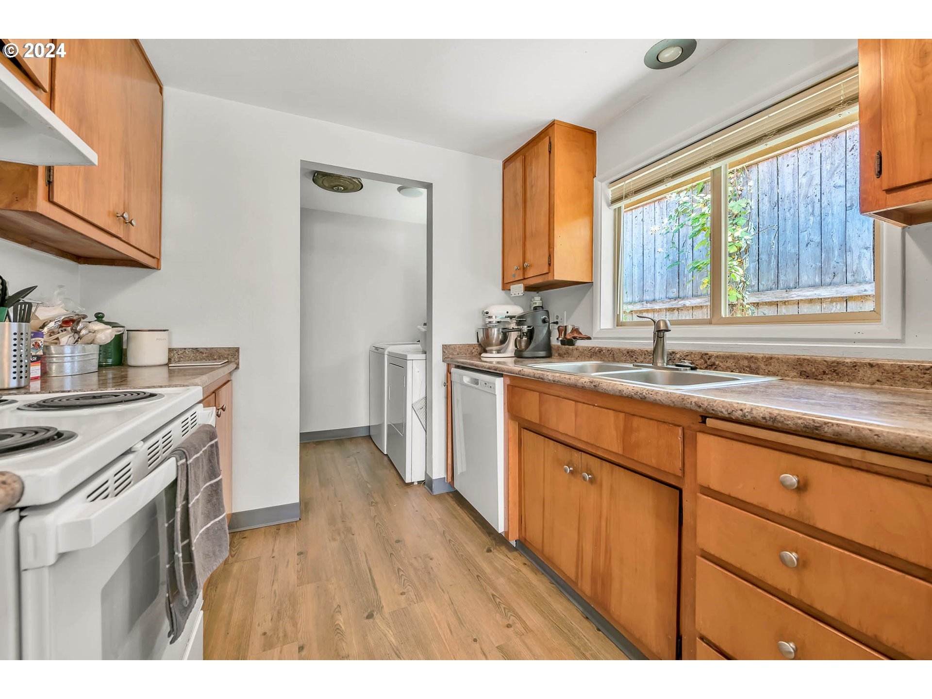 5000 Whiteaker Street Eugene, OR 97405 - Photo 7 of 18 a kitchen with a sink stove and cabinets