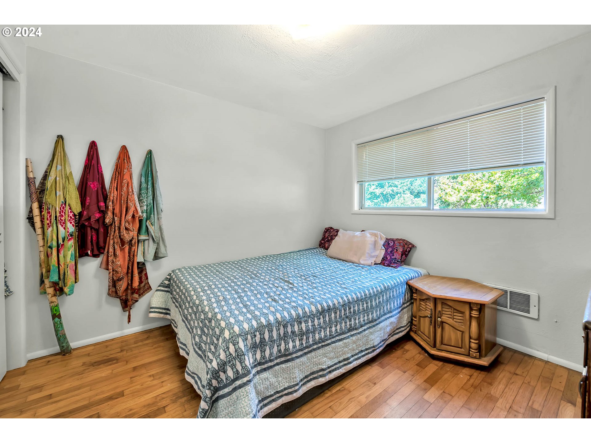 5000 Whiteaker Street Eugene, OR 97405 - Photo 10 of 18 a bedroom with a bed and a wooden floor