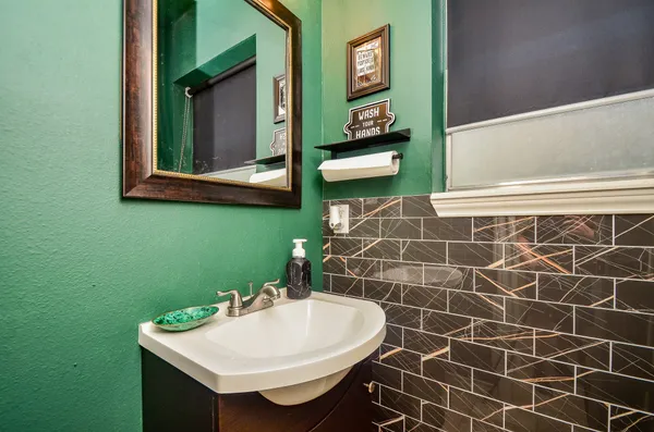 a bathroom with a sink and a mirror