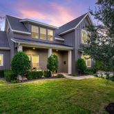 a view of a house with a yard and plants