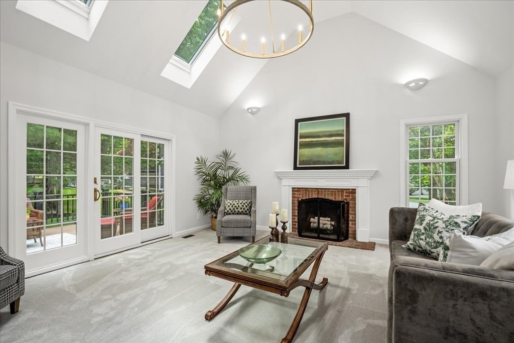 4 Round Table Road Shrewsbury, MA 01545 - Photo 12 of 41 a living room with furniture and a fireplace