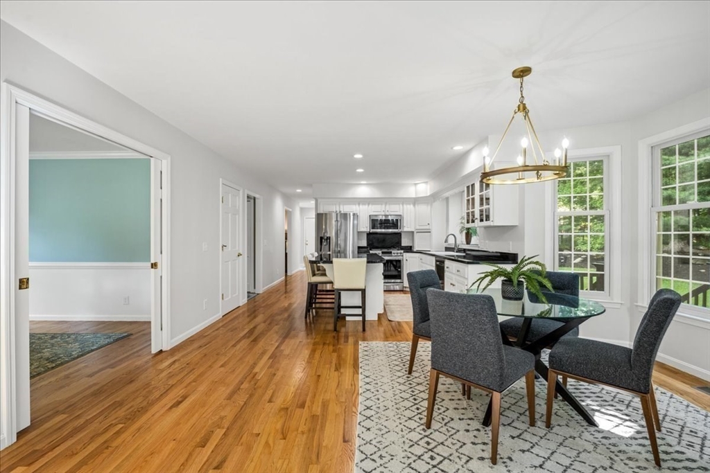 4 Round Table Road Shrewsbury, MA 01545 - Photo 14 of 41 a view of a dining room with furniture window and wooden floor
