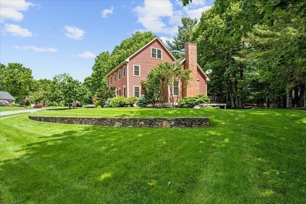 4 Round Table Road Shrewsbury, MA 01545 - Photo 39 of 41 a front view of a house with a garden