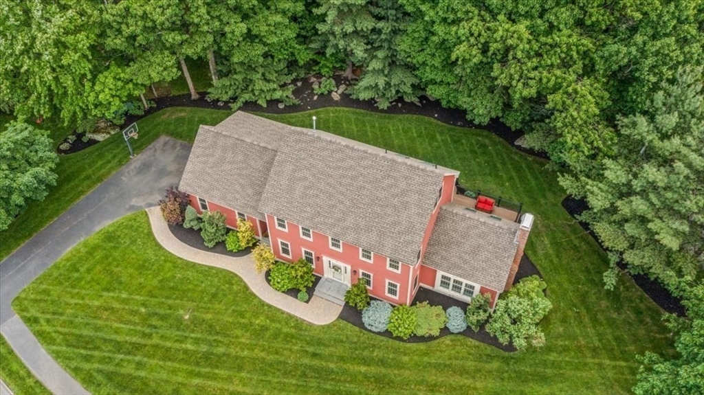 4 Round Table Road Shrewsbury, MA 01545 - Photo 4 of 41 a sign that is sitting on a wooden fence