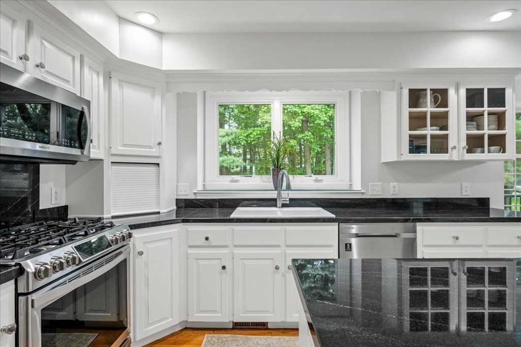 4 Round Table Road Shrewsbury, MA 01545 - Photo 6 of 41 a kitchen with granite countertop a sink stainless steel appliances and cabinets