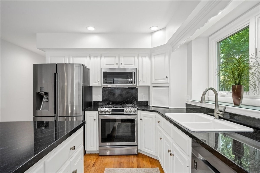 4 Round Table Road Shrewsbury, MA 01545 - Photo 7 of 41 a kitchen with a sink stove and refrigerator