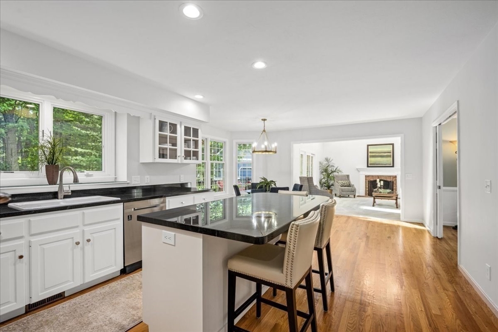 4 Round Table Road Shrewsbury, MA 01545 - Photo 8 of 41 a kitchen with a table chairs stove and cabinets