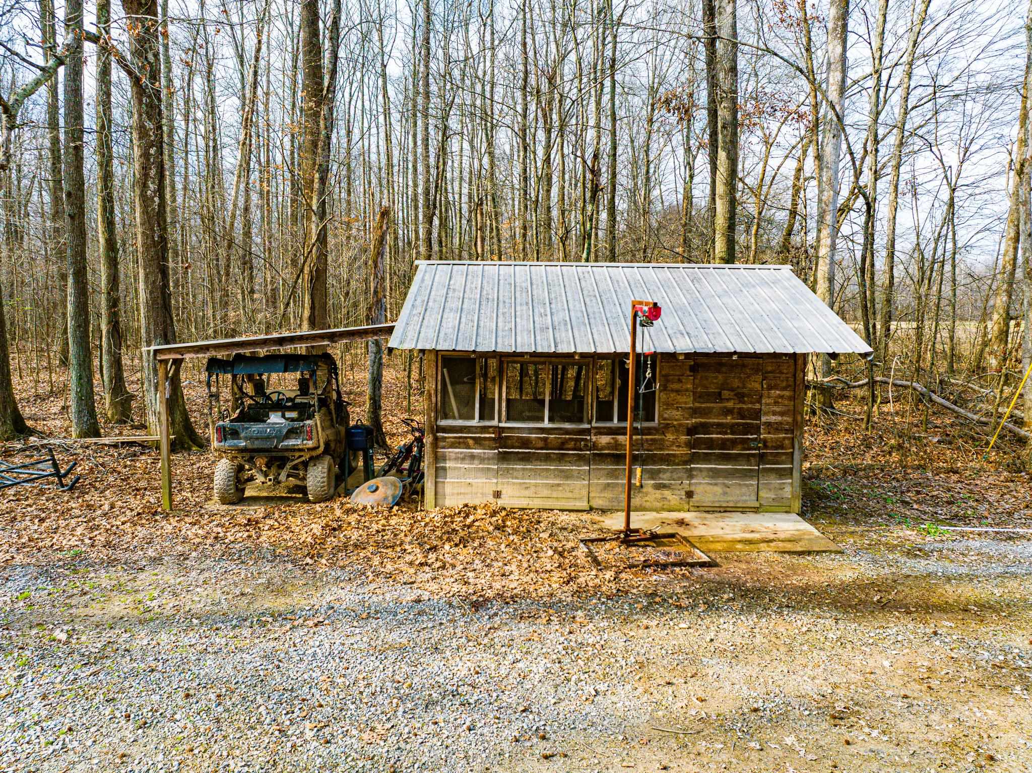 280 Fields Road Dukedom, TN 38226 - Photo 39 of 40 a view of a big house with large trees and wooden fence