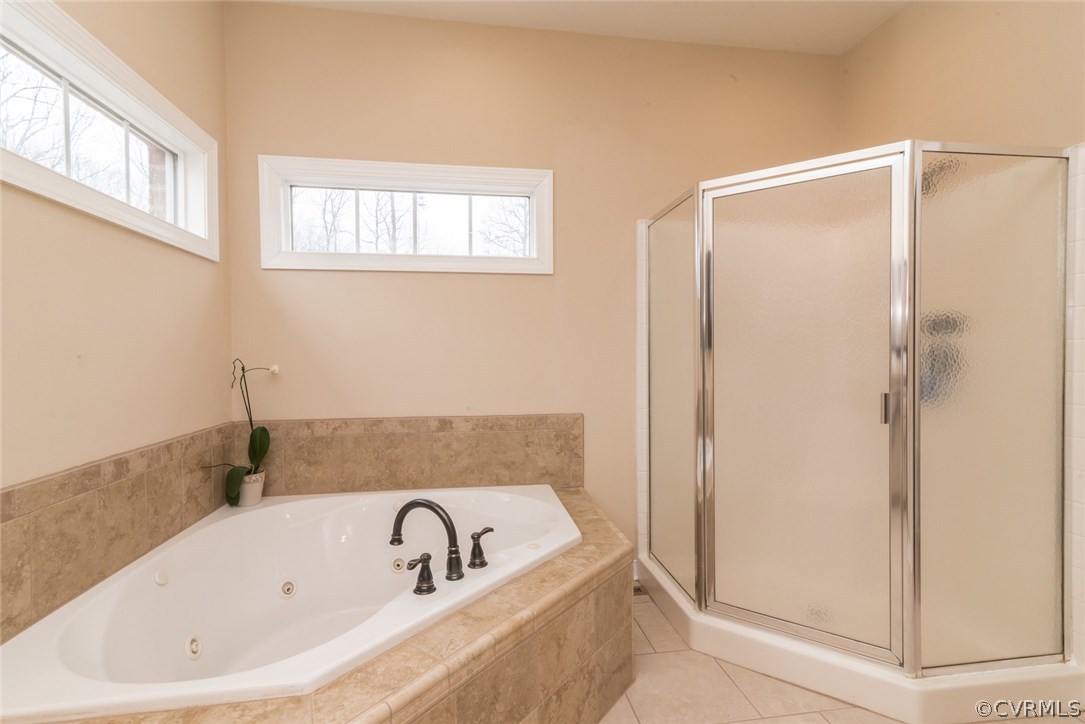 20843 Beaver Dam Road Beaverdam, VA 23015 - Photo 17 of 50 a bathroom with a tub and shower
