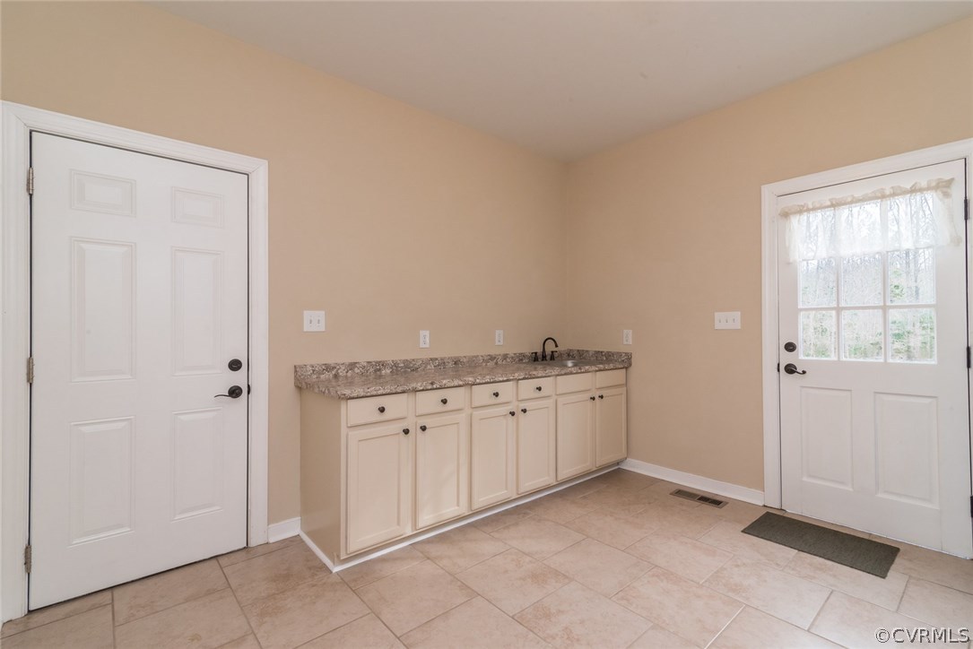20843 Beaver Dam Road Beaverdam, VA 23015 - Photo 21 of 50 a spacious bathroom with a granite countertop sink and a mirror