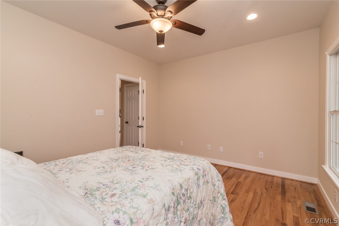 20843 Beaver Dam Road Beaverdam, VA 23015 - Photo 25 of 50 a bedroom with a bed and a chandelier fan