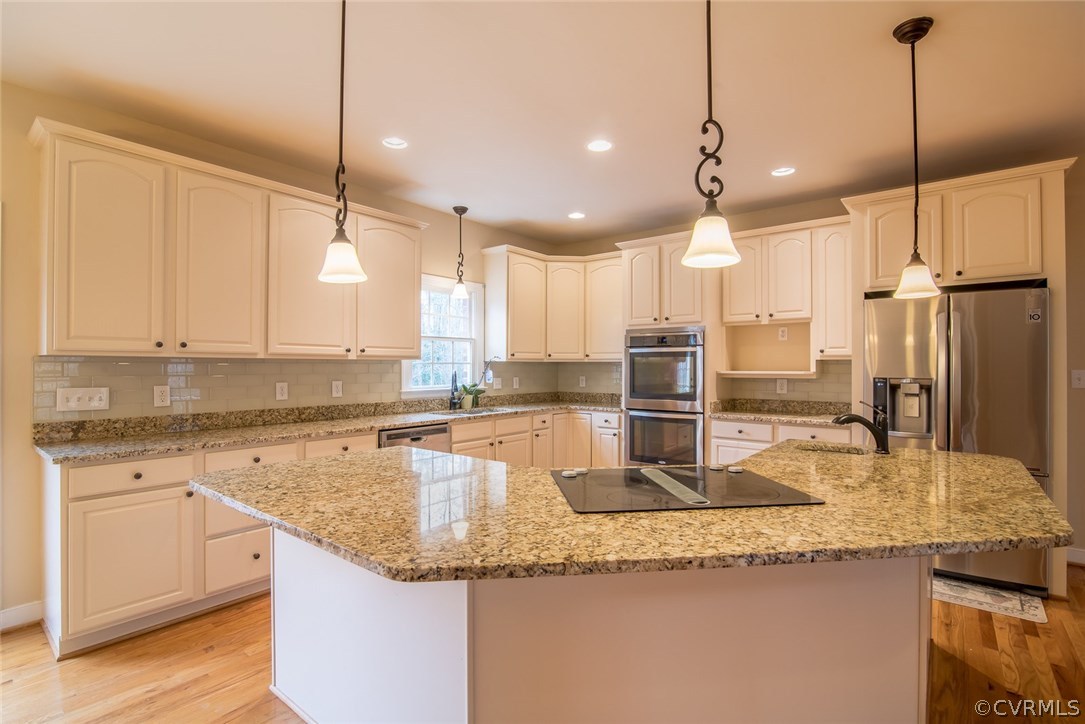20843 Beaver Dam Road Beaverdam, VA 23015 - Photo 29 of 50 a kitchen with granite countertop a sink a counter top space appliances and cabinets