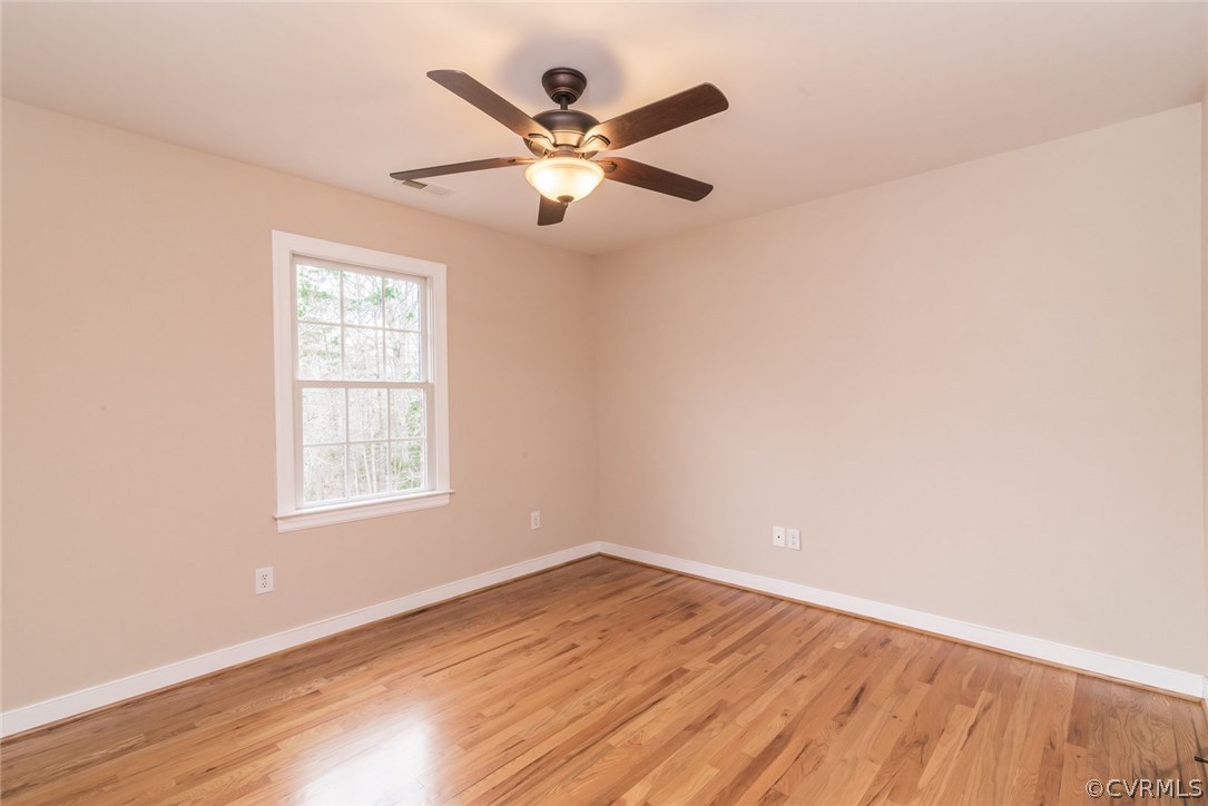 20843 Beaver Dam Road Beaverdam, VA 23015 - Photo 37 of 50 an empty room with wooden floor fan and windows