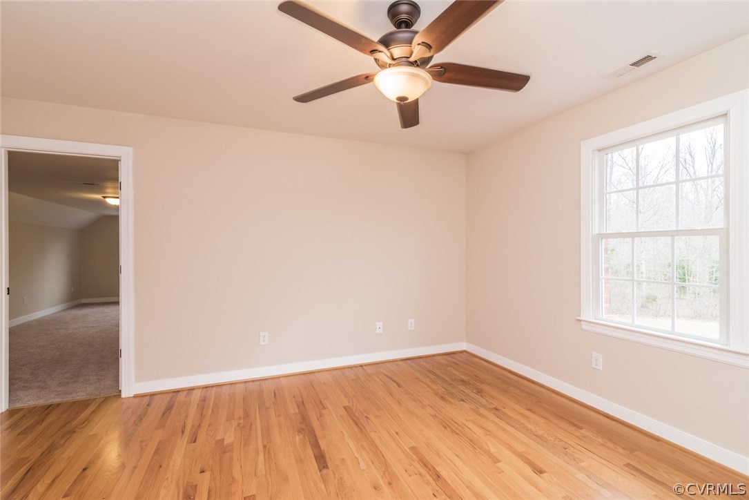 20843 Beaver Dam Road Beaverdam, VA 23015 - Photo 39 of 50 an empty room with wooden floor fan and windows
