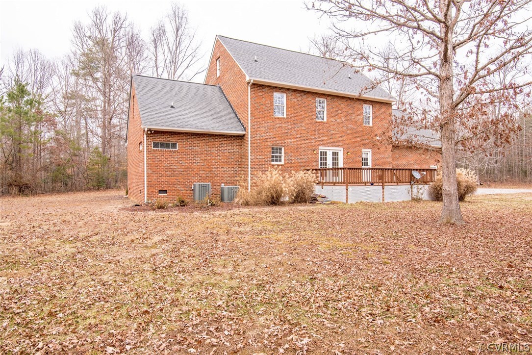 20843 Beaver Dam Road Beaverdam, VA 23015 - Photo 50 of 50 a front view of a house with a yard covered with snow and trees