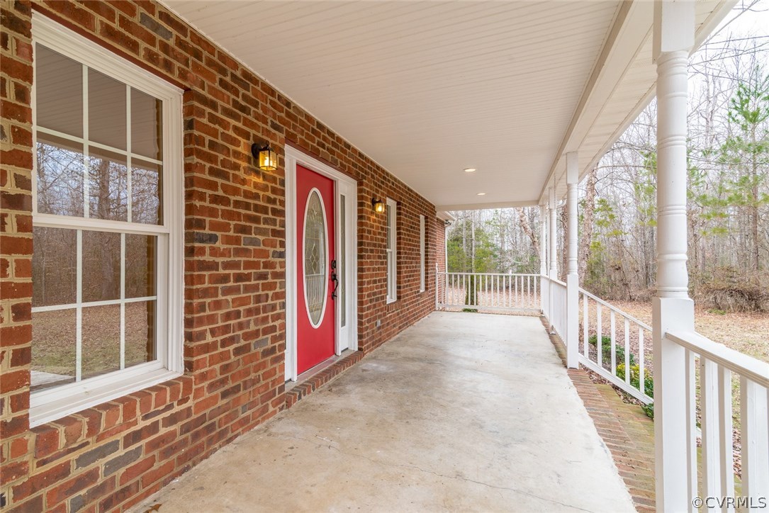 20843 Beaver Dam Road Beaverdam, VA 23015 - Photo 6 of 50 a view of a porch with wooden floor and stairs