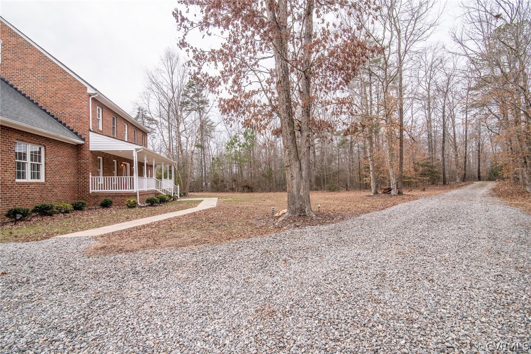 20843 Beaver Dam Road Beaverdam, VA 23015 - Photo 8 of 50 a backyard of a house with large trees